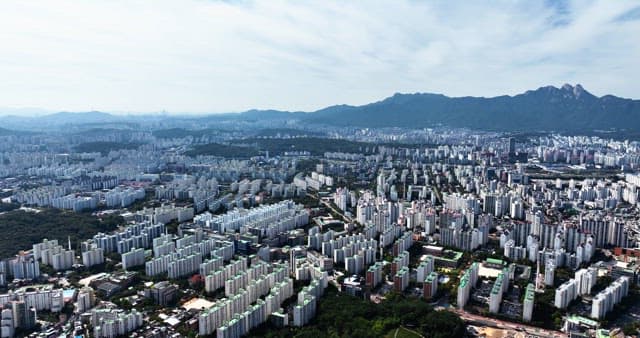 Expansive cityscape with mountains in the background