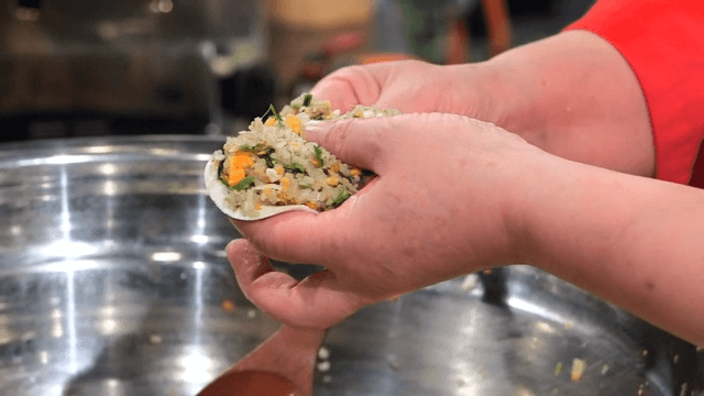 Preparing dumplings with vegetable filling