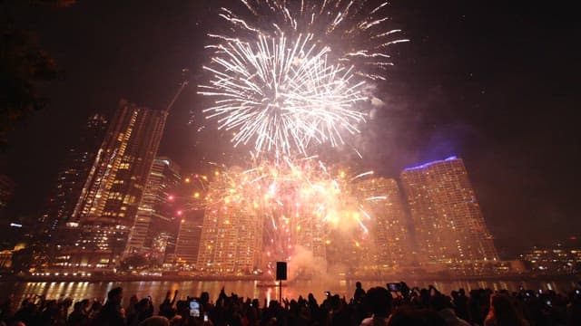 Fireworks display over a city skyline