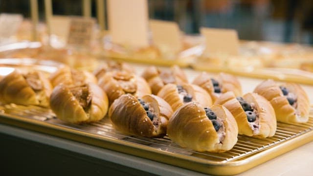 Bread with Bluberries Neatly Displayed in a Bakery