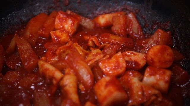 Spicy tteokbokki simmering in a pan