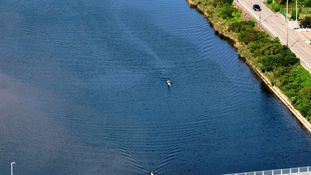 Kayaker paddling on a calm river