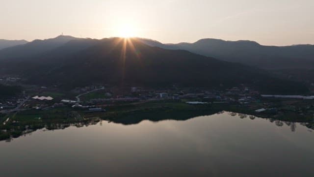 Sunrise over a mountain and village