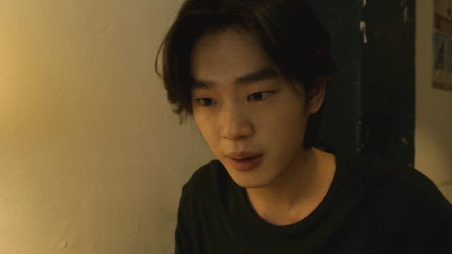 Man sitting at a desk and smiling