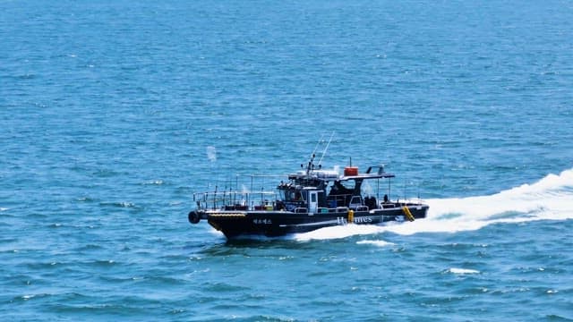 Patrol Boat Navigating Blue Seas