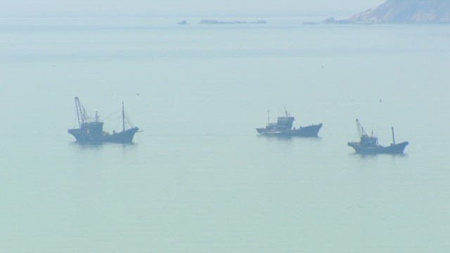 Fishing Boats at Sea on a Misty Day