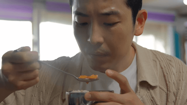 Man enjoying a hot meal indoors