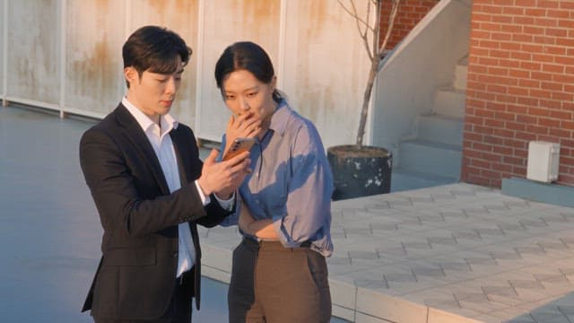 Two colleagues discussing on a rooftop