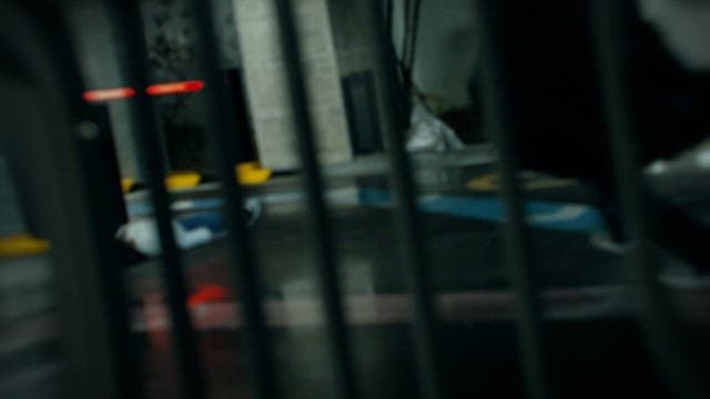 Man Waking up His Fallen Friend on Road at Night