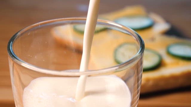 Fresh Milk Being Poured into a Glass