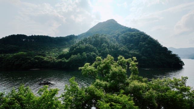 Serene lake surrounded by lush green mountains