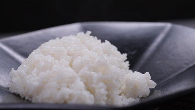 Spicy pork stir-fry served over rice