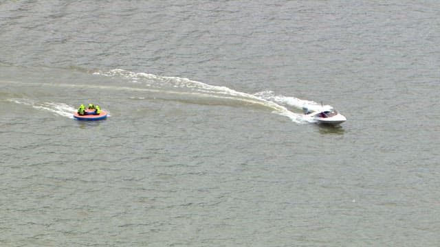 Bouncing Boat Hanging from a Motorboat