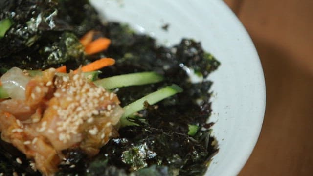 Delicious chewy noodles topped with kimchi and laver