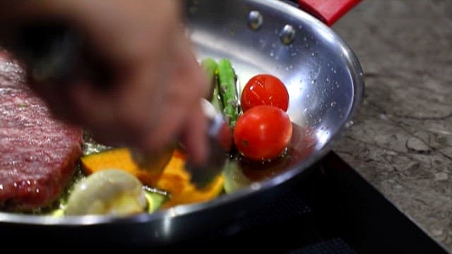 Ingredients for Steak Sizzling in Oil on a Pan
