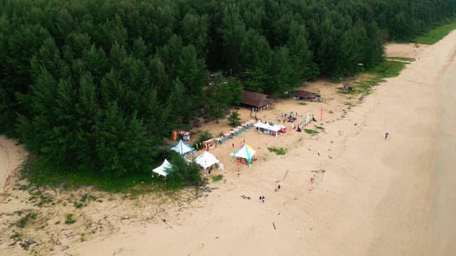 Beach festival with tents and people