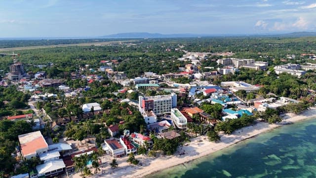 Coastal town with vibrant buildings and beach