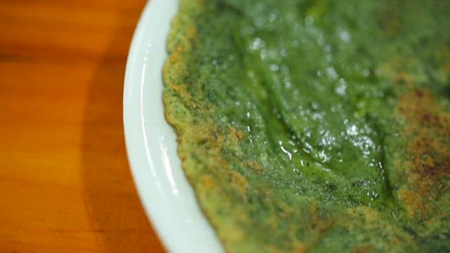 Green pancakes on a plate