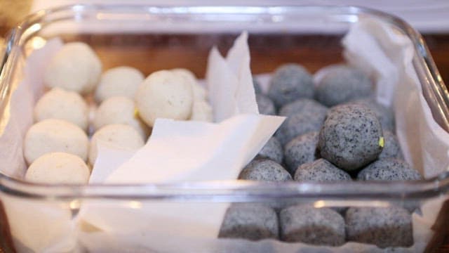Round glutinous rice cake ball dough in a plastic container