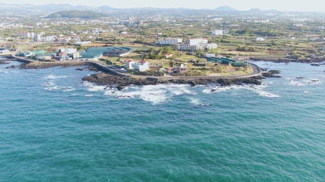 Coastal village with ocean waves