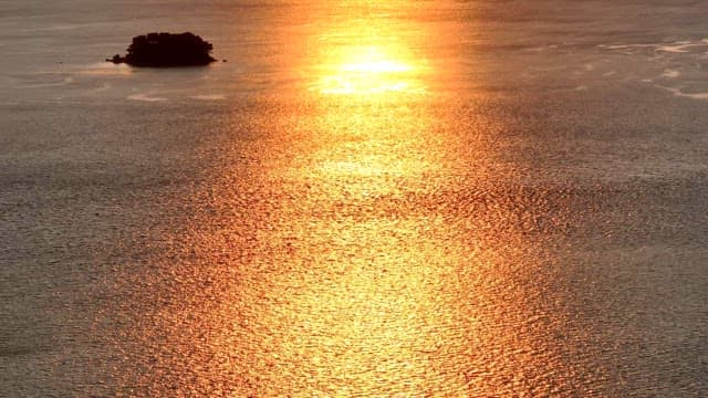 Sunset reflecting on the calm sea