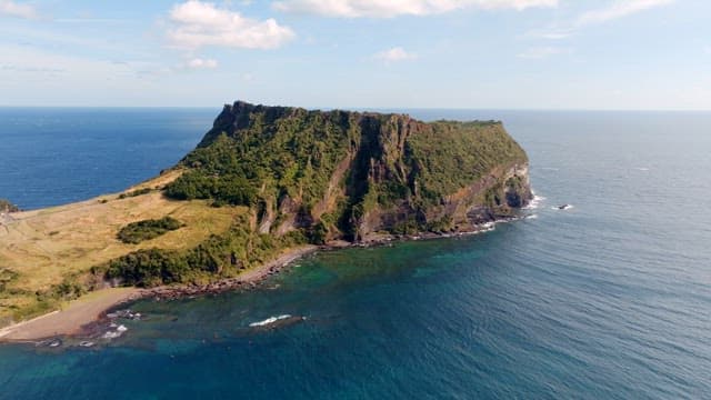 Scenic island with lush greenery and ocean
