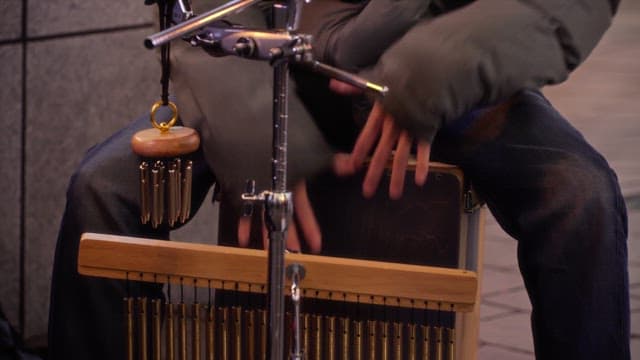 Street musician playing a cajón