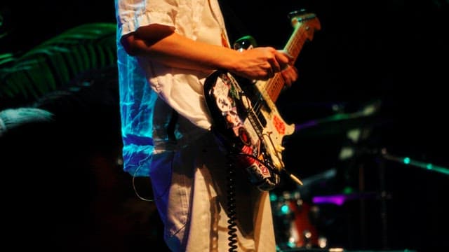 Musician Playing Electric Guitar On Stage