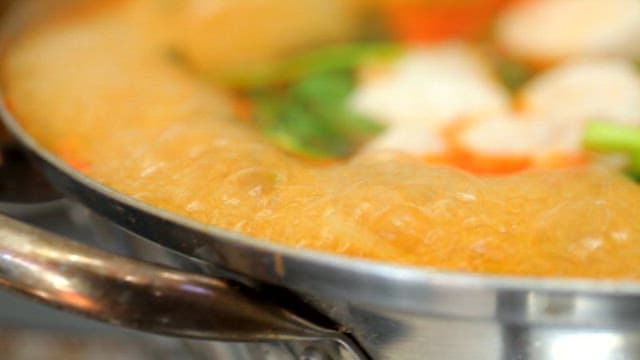 Stew with vegetables and puffer fish is boiling
