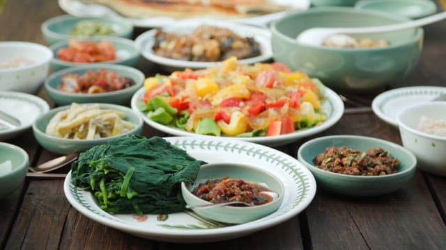 Hearty Korean meal with a variety of side dishes and grilled fish