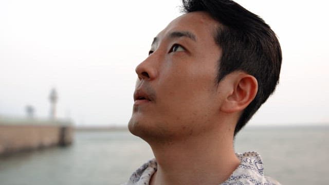 Man looking thoughtfully at the sea