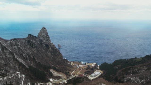 Snowy Coastal Cliffs Overlooking the Ocean