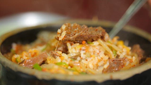 Spoonful of beef and rice soup