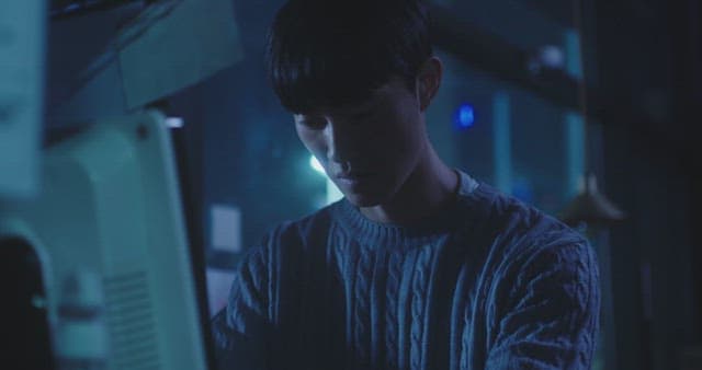 Man shouting in anger in a dark room late at night