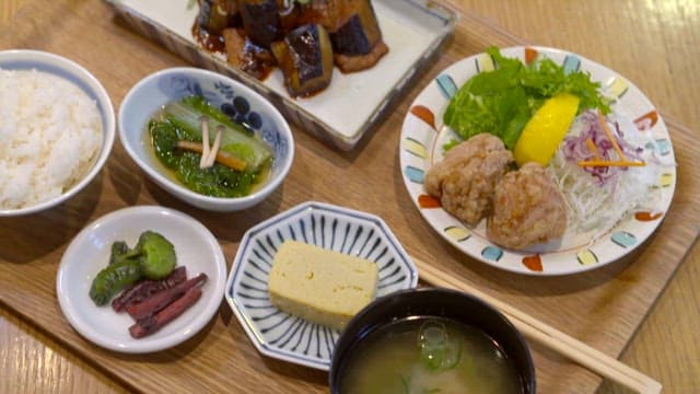 Traditional Japanese meal beautifully served on wooden table
