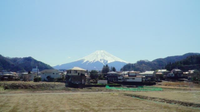Mount Fuji viewed from a small rural town during daytime