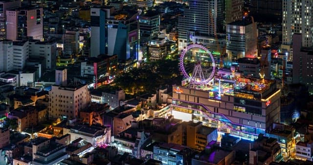 Night view of downtown Daegu illuminated by a ferris wheel at night