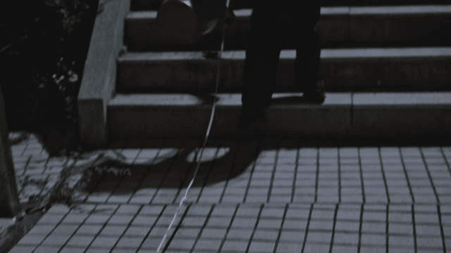 Dark Building Entrance and Stairs in City at Night