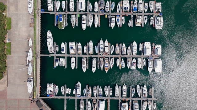 Yachts orderly moored at a peaceful marina