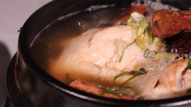 Steaming Bowl of Hearty Samgyetang with Medicinal Herbs