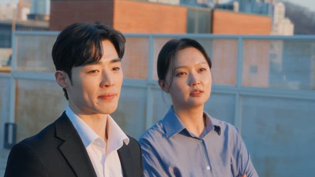 Two people conversing on a rooftop