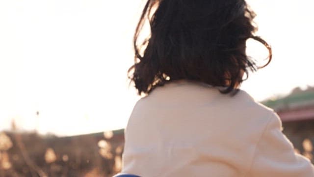 Child Passing through the Park on a Sunny Day
