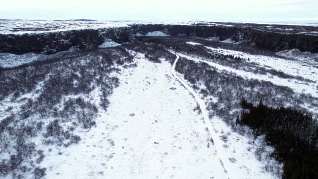 Snow-covered landscape with cliffs