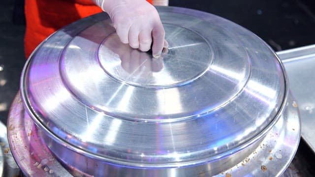 Chicken hotpot with various ingredients boiling in a cauldron