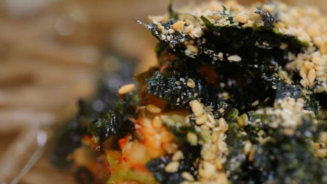Appetizing buckwheat noodles topped with seaweed and sesame seeds