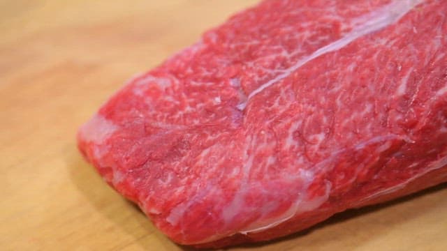 Fresh Raw Meat on Wooden Cutting Board