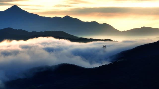 Sunlight breaking through dark clouds