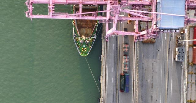 A ship docked at an industrial port