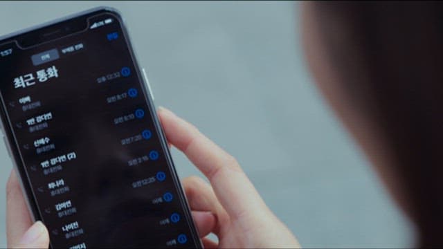 Person Reading an Article of Fire Accident on a Smartphone Screen