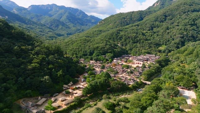Traditional Korean house village nestled in lush mountains